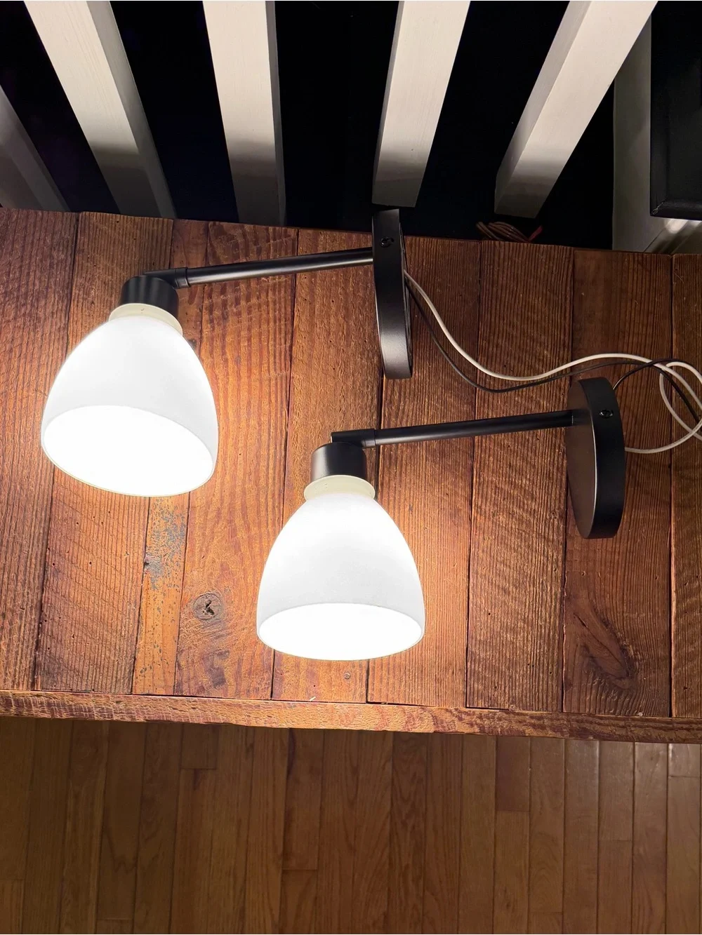 Pair of adjustable swivel/pivot black wall-mount lamps with frost white glass